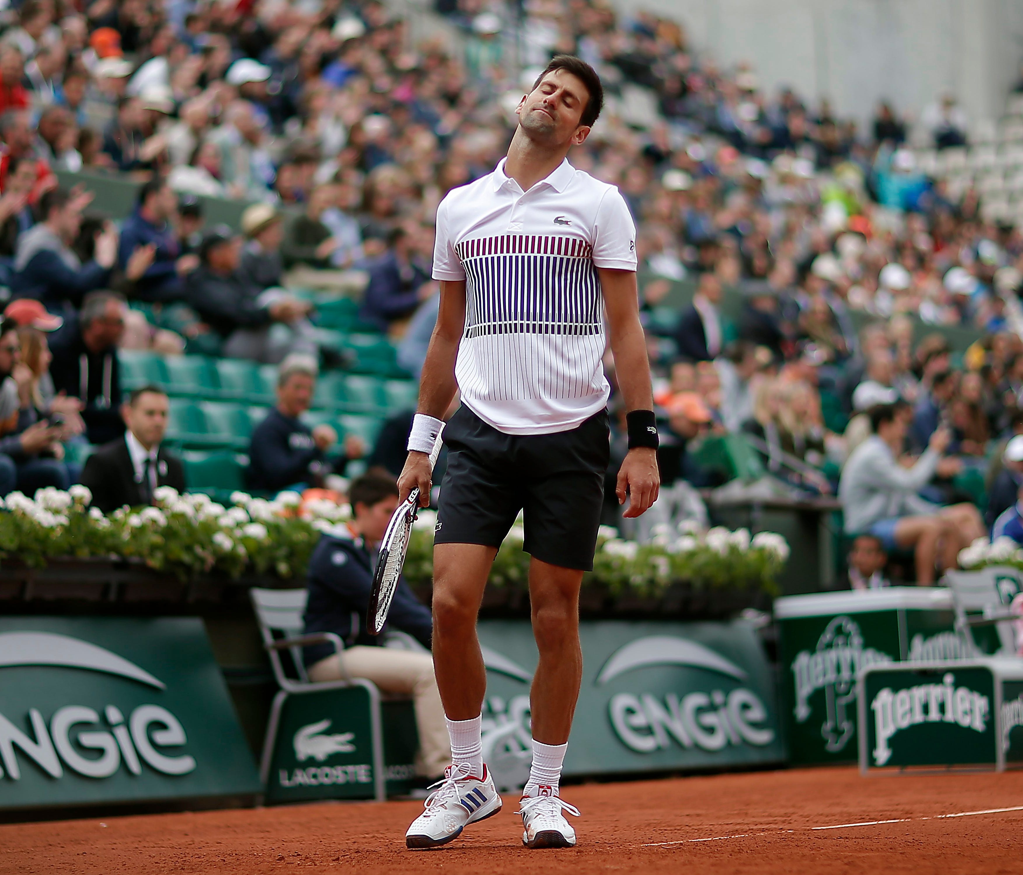 Novak Djokovic reacts during his loss to Dominic Thiem in the French Open quarterfinals