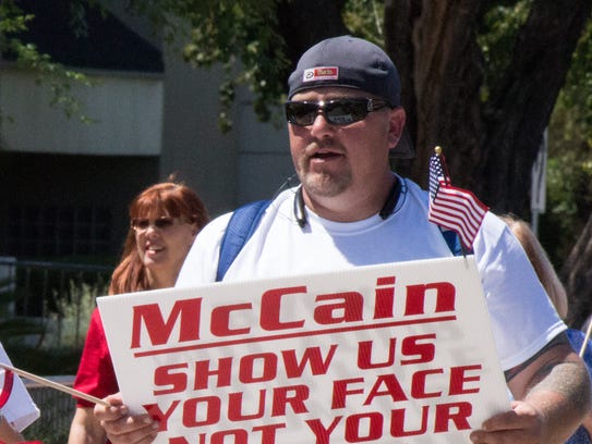 "Operation Detain McCain" participants walk toward