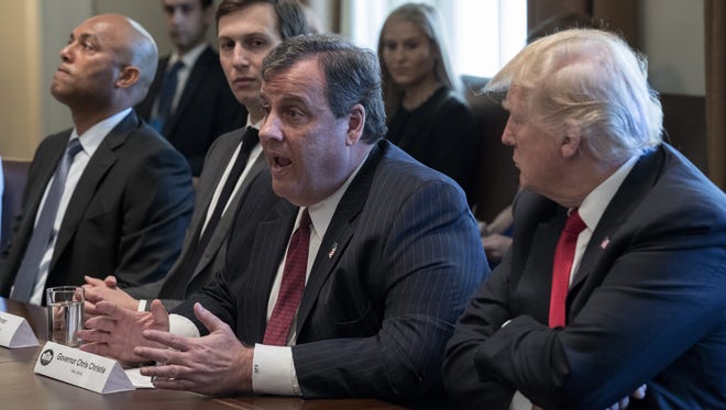New Jersey Gov. Chris Christie delivers remarks as President Trump looks on in the Roosevelt Room on March 29, 2017.