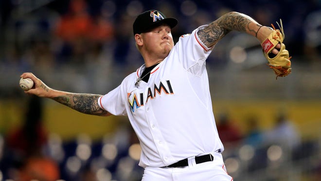 Marlins starting pitcher Mat Latos throws the ball in the first inning against the Giants at Marlins Park on June 30.