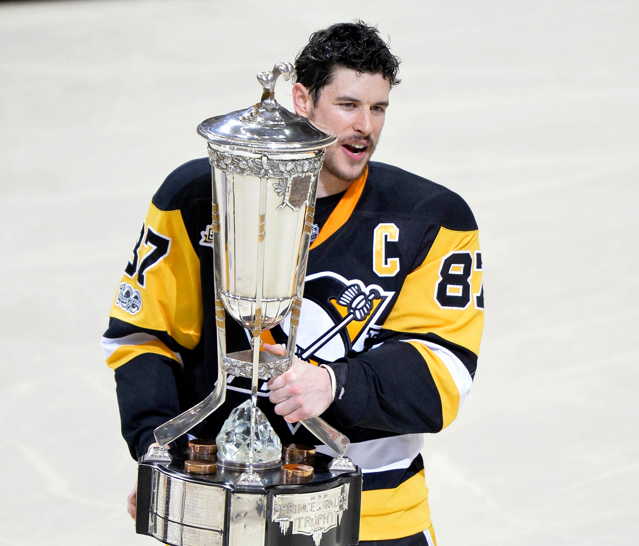 Pittsburgh Penguins center Sidney Crosby skates off of the ice with the Prince of Whales Trophy after beating the Ottawa Senators in double overtime of Game 7.