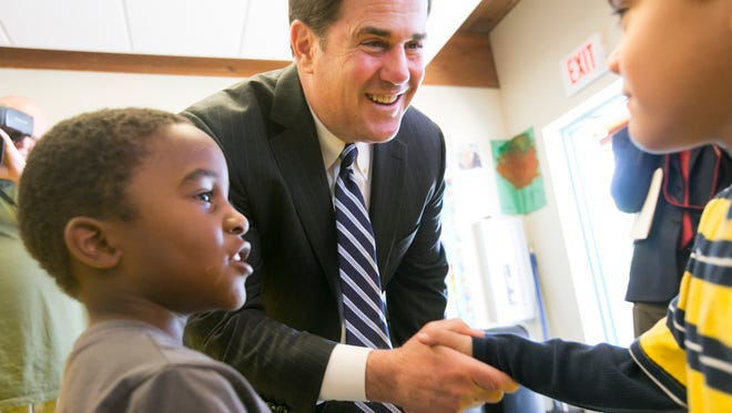 Arizona Gov. Doug Ducey speaks to students at a preschool class at Martin Luther King Elementary School in Phoenix on Tuesday, April 7, 2015.