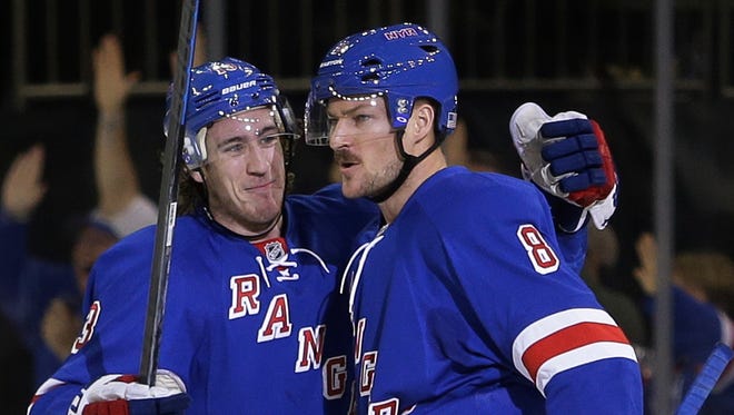 The Rangers' Kevin Klein, right, celebrates with Kevin Hayes after scoring a goal during the first period of  Tuesday night's game against the Pittsburgh Penguins.