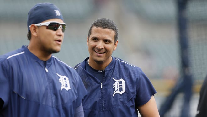 Detroit Tigers designated hitter Victor Martinez, right, stands behind first baseman Miguel Cabrera during batting practice Aug. 26, 2015, in Detroit.