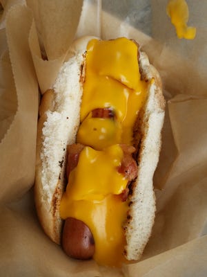 The Hog Tied Dog is a hot dog wrapped in bacon and slathered in nacho cheese. Oh yeah, and it has a ridiculously good bun. That’s a winner.