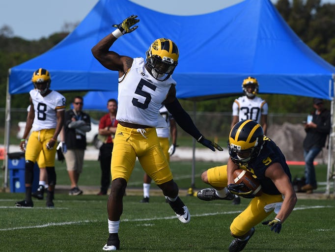 Michigan's Jabrill Peppers (5) covers wide receiver