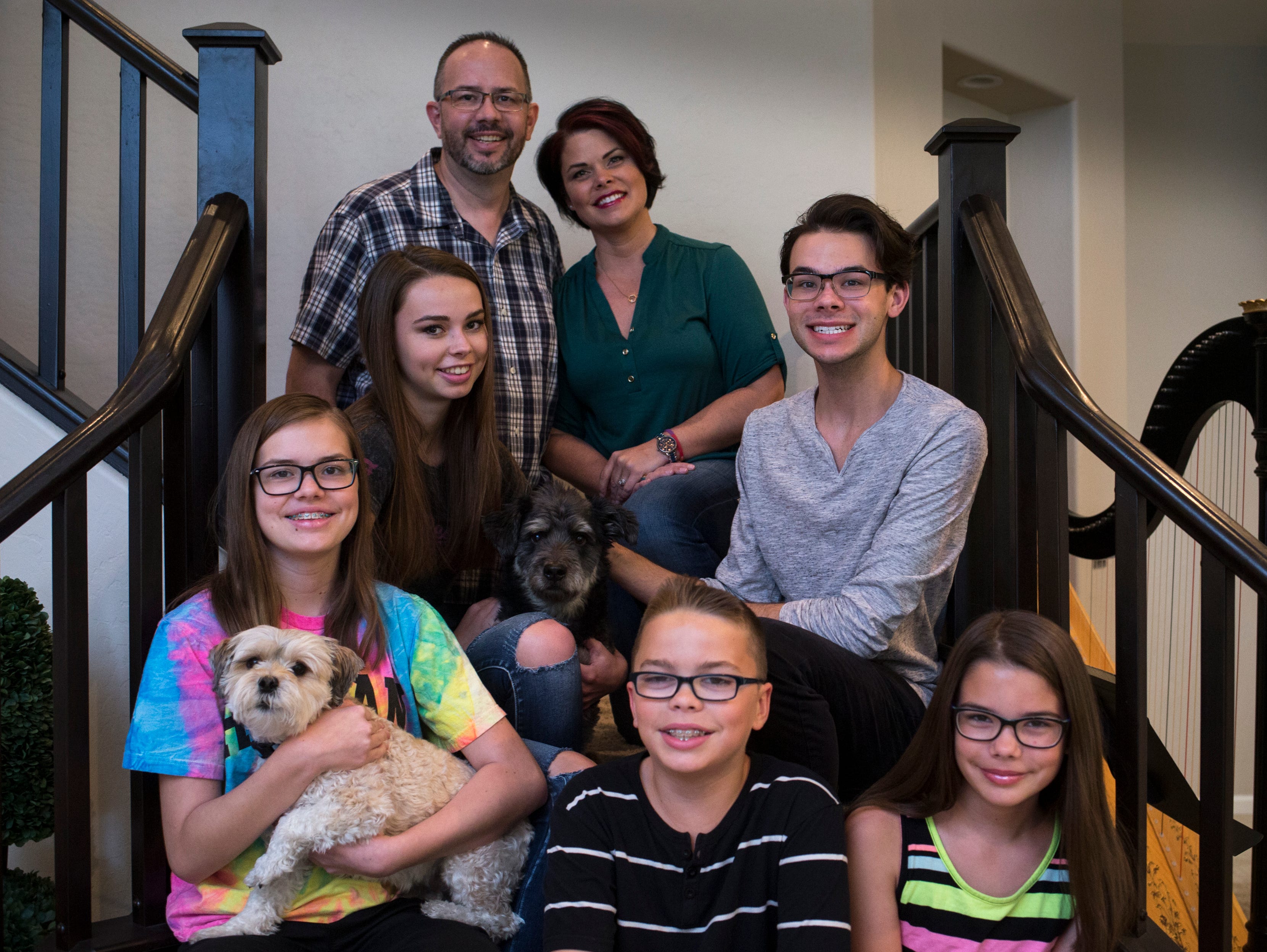 Tom and Wendy Montgomery supported their son Jordan when they discovered he was gay. (Clockwise from top left), Tom, Wendy, Jordan, Emma, Ethan and Susannah June 9, 2017, in their Chandler Az home.