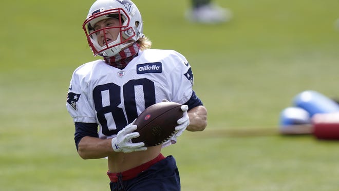 New England Patriots wide receiver Gunner Olszewski runs with the ball during Wednesday's training camp practice in Foxborough.