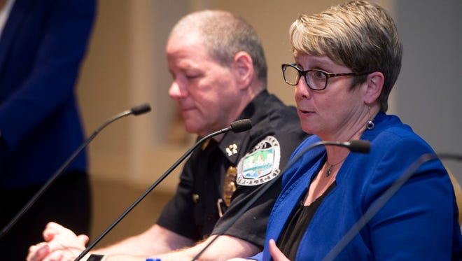 Dr. Martha Buchanan answers questions during a panel discussion on opiates and domestic violence on Wednesday, April 26, 2017 at the East Tennessee History Center. At left is Knoxville Police Chief David Rausch.