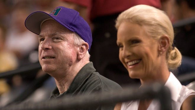 U.S. Sen. John McCain of Arizona and his wife, Cindy, watch the Arizona Diamondbacks play the Houston Astros on Aug. 4, 2006, at Chase Field in Phoenix.