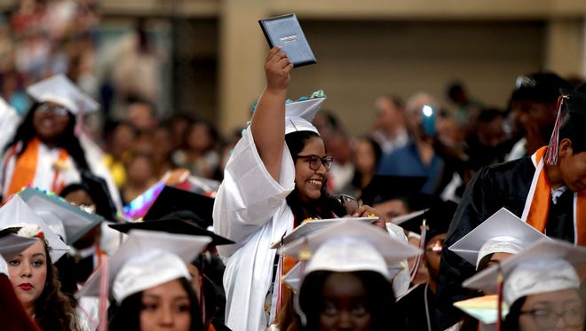 Giselle Del Rocio Chuya holds her diploma during Spring Valley High School's graduation ceremony at Rockland Community College on Sunday, June 24, 2018.