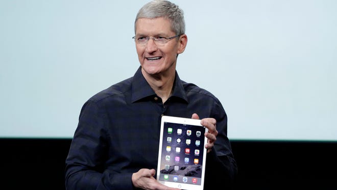 Apple CEO Tim Cook introduces the new Apple iPad Air 2 during an event at Apple headquarters on Thursday, Oct. 16, 2014 in Cupertino, Calif.