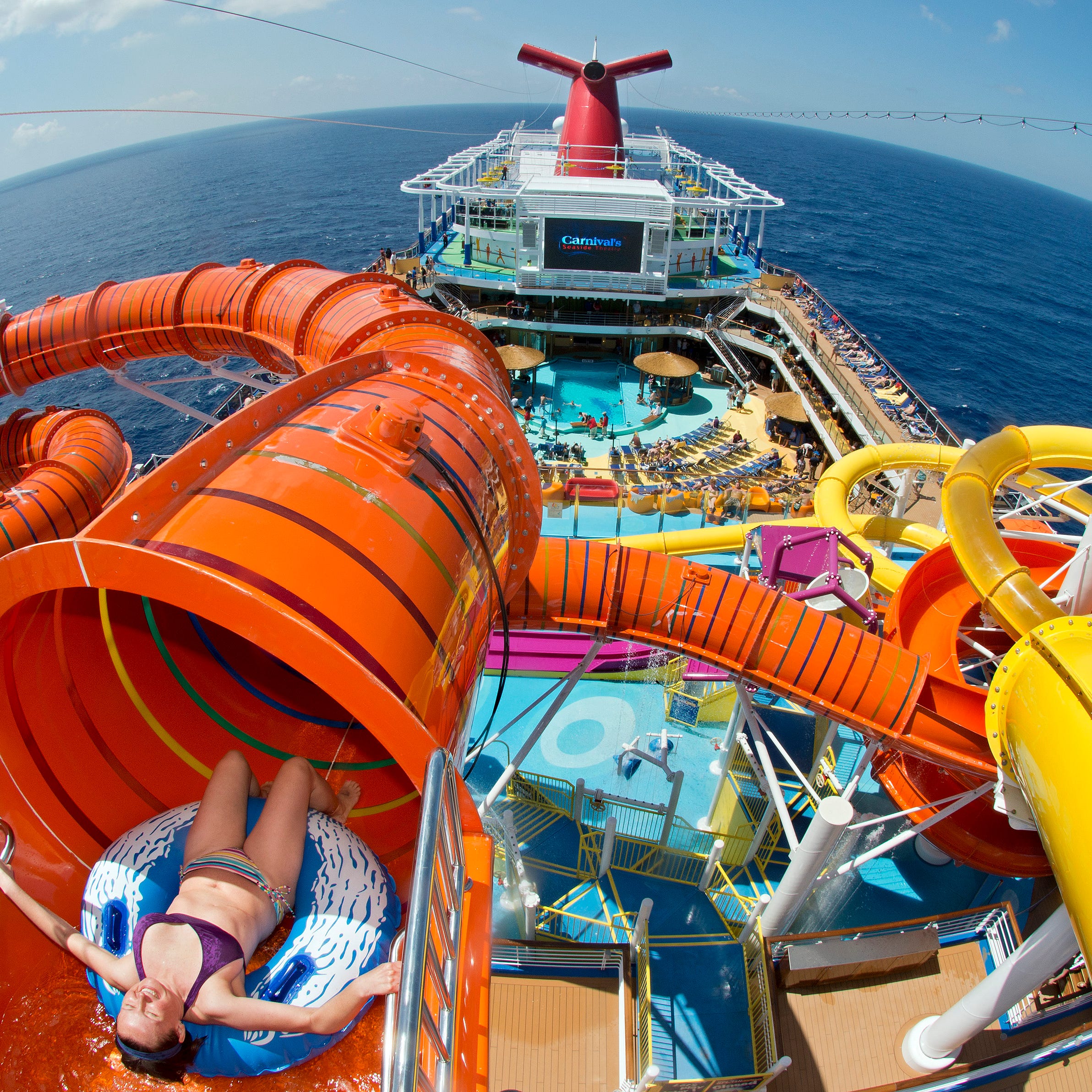 The orange Kaleid-O-Slide is part of the WaterWorks fun zone atop cruise giant Carnival's new Carnival Vista.
