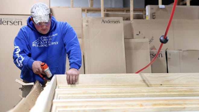 
Justin Luft puts an extension jam on windows at Drexel Building Supply in Campbellsport. The family-owned business was started in 1985 by Albert Fleischman.
