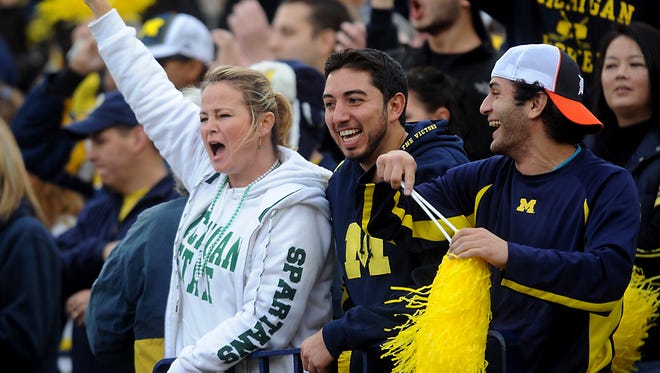 MSU and Michigan fans cheer in Ann Arbor.