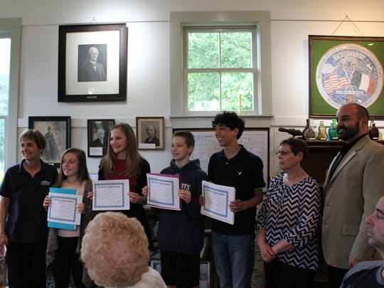 Anne Marie DeCicco (left to right), president of the Hammonton Historical Society, stands with eighth-grade students Ashley Westfall, Julia Sulzner, Alex Giordano and Sam Donio. Denise Saia, secretary of the Hammonton Historical Society, and Jason Massara, the students’ eighth-grade Social Studies teacher, proudly look on.