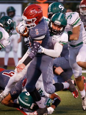 Farmington's Kale Lucas tackles Durango's Dawson Marcum during Friday's game in Colorado. The Scorpions are ranked ninth in this week's 5A football poll.