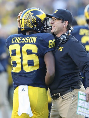 Michigan Wolverines head coach Jim Harbaugh hugs Jehu Chesson after his touchdown during the first half against the Maryland Terrapins on Saturday, Nov. 5, 2016 at Michigan Stadium.