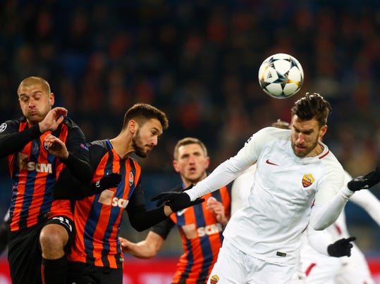 Roma's Kevin Strootman, right jumps for the ball during the Champions League, round of 16, first-leg soccer match between Shakhtar Donetsk and Roma at the Metalist Stadium in Kharkiv, Ukraine, Wednesday, Feb. 21, 2018. (AP Photo/Efrem Lukatsky)