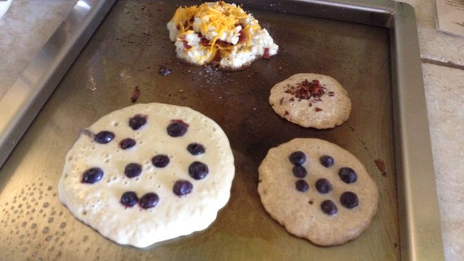 Blueberries and bacon add flavor to the pancake batter, along with cheese and bacon for the potato pancakes.
