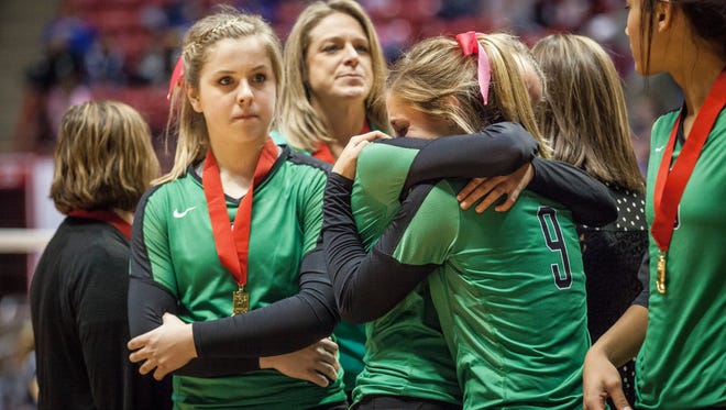 Yorktown Player console each other after losing to providence during the the IHSAA class 3A State Tournament in Worthen Arena. Yorktown finished the season overall 38-2.