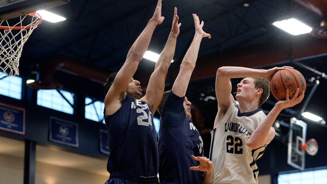 In this file photo, Lebanon Valley College's Andy Orr drives to the hoop against Messiah's David Fernandez-Bravo (left) and Aaron DeVan (center)   at  Sorrentino Gymnasium at LVC on Saturday, January 24, 2015. Orr led LVC to the Rinso Marquette Tournament title on Saturday, November 21, with 27 points.