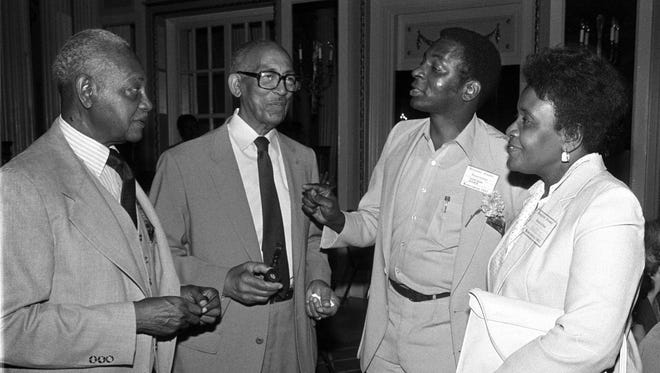 From left, J.D. Springer, Melvin Conley, Richard Bowden and Ida Ghoston reminisce at the Douglass Park reunion at The Peabody on May 28, 1982. The event included anyone who had ever lived in the Douglass Park Community or gone to Douglass High School and drew people from as far away as California. Springer was principal of the school from 1951 to 1959 and was followed by Conley in 1959-60. The school was closed in September 1981.
