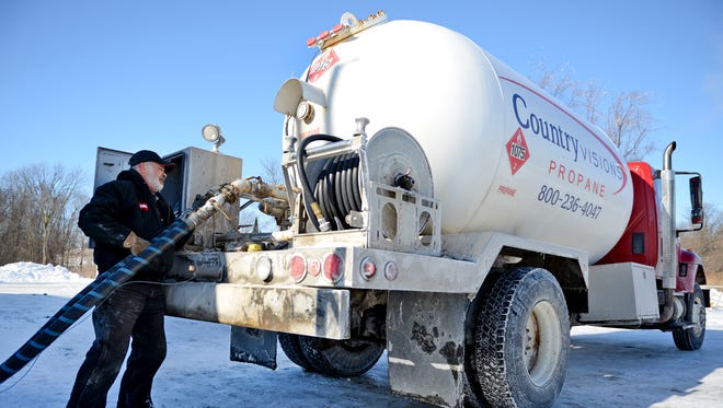 Jerry Petasek refills his propane delivery truck at the Country Visions Cooperative facility in the town of Lawrence.
