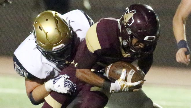 Andress wide receiver Diego Lewis, 3, is brought down just shy of the goal line against Coronado Friday at Andress. The play resulted in a 3-point field goal for the Eagles.