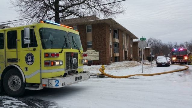 Springfield firefighters work Sunday, Jan. 14, 2018, at the Nu Elm Apartments in Springfield.