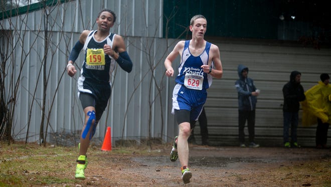 Valley Christian's Wesley Schiek, left, and Assumption's Connor Dolan run during Division 3 boys race at the 2015 State Cross Country Championships at the Ridges Country Club in Wisconsin Rapids, Saturday, Oct. 31, 2015.