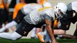 Jakob Johnson (44) stretches during spring training