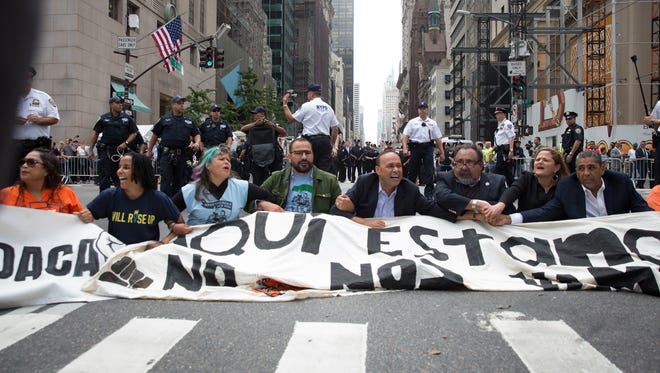 Activists sit on Fifth Avenue in an action of civil disobedience near Trump Tower on September 19, 2017 in New York, New York.