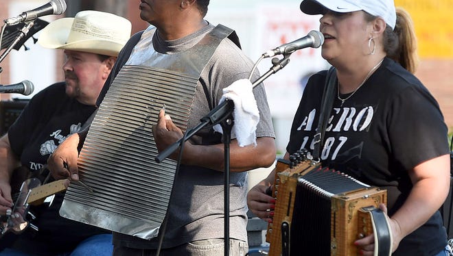 Amy Nicole and Zydeco Soul entertain at Saturday's Zydeco Breakfast in downtown Opelousas.