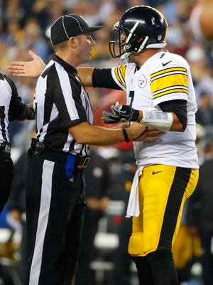 Pittsburgh Steelers quarterback Ben Roethlisberger, right, appeals to an official in the second half of an NFL football game against the New England Patriots, Thursday, Sept. 10, 2015, in Foxborough, Mass.