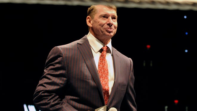 FILE - In this Oct. 30, 2010 file photo, WWE chairman and CEO Vince McMahon speaks to an audience during a WWE fan appreciation event in Hartford, Conn.   WWE's 'Raw' set out to be a special kind of wrestling show from its birth on Jan. 11, 1993. "Welcome everyone, to Monday Night Raw!" McMahon bellowed. "We are live from New York City!" The WWE will celebrate the 25th anniversary of "Raw" on Jan. 22, 2018 at its original home of the Manhattan Center with some of the biggest stars in the company's history stopping by for a fight. (AP Photo/Jessica Hill, File) ORG XMIT: NY110