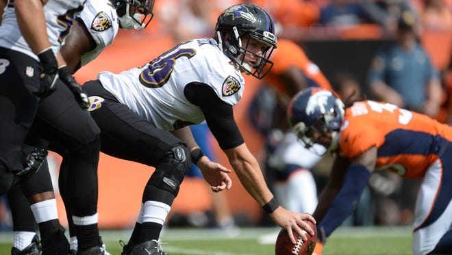 Baltimore Ravens long snapper Morgan Cox (46) prepares to hike the ball in the first quarter against the Denver Broncos at Sports Authority Field at Mile High.