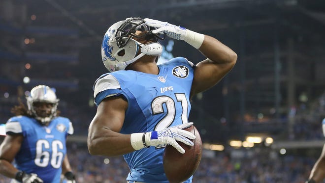Ameer Abdullah of the Detroit Lions celebrates a third quarter touchdown while paying the Denver Broncos at Ford Field on September 27, 2014 in Detroit.