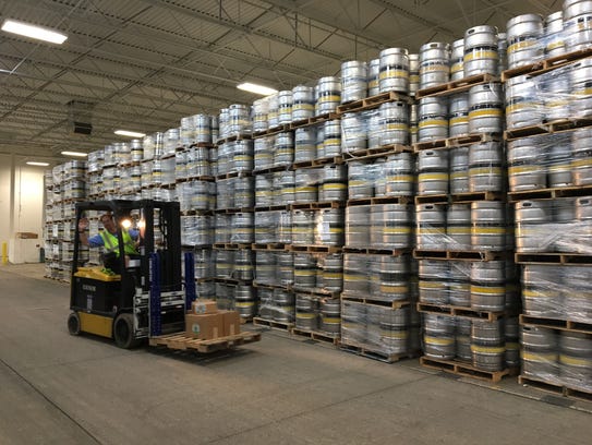 A forklift is driven in front of stacks of kegs in September 2016 at Bell's Comstock Brewery in Galesburg.