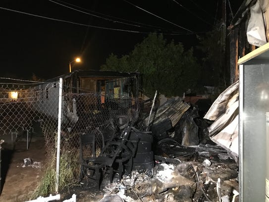 Two families have been displaced after a shed fire