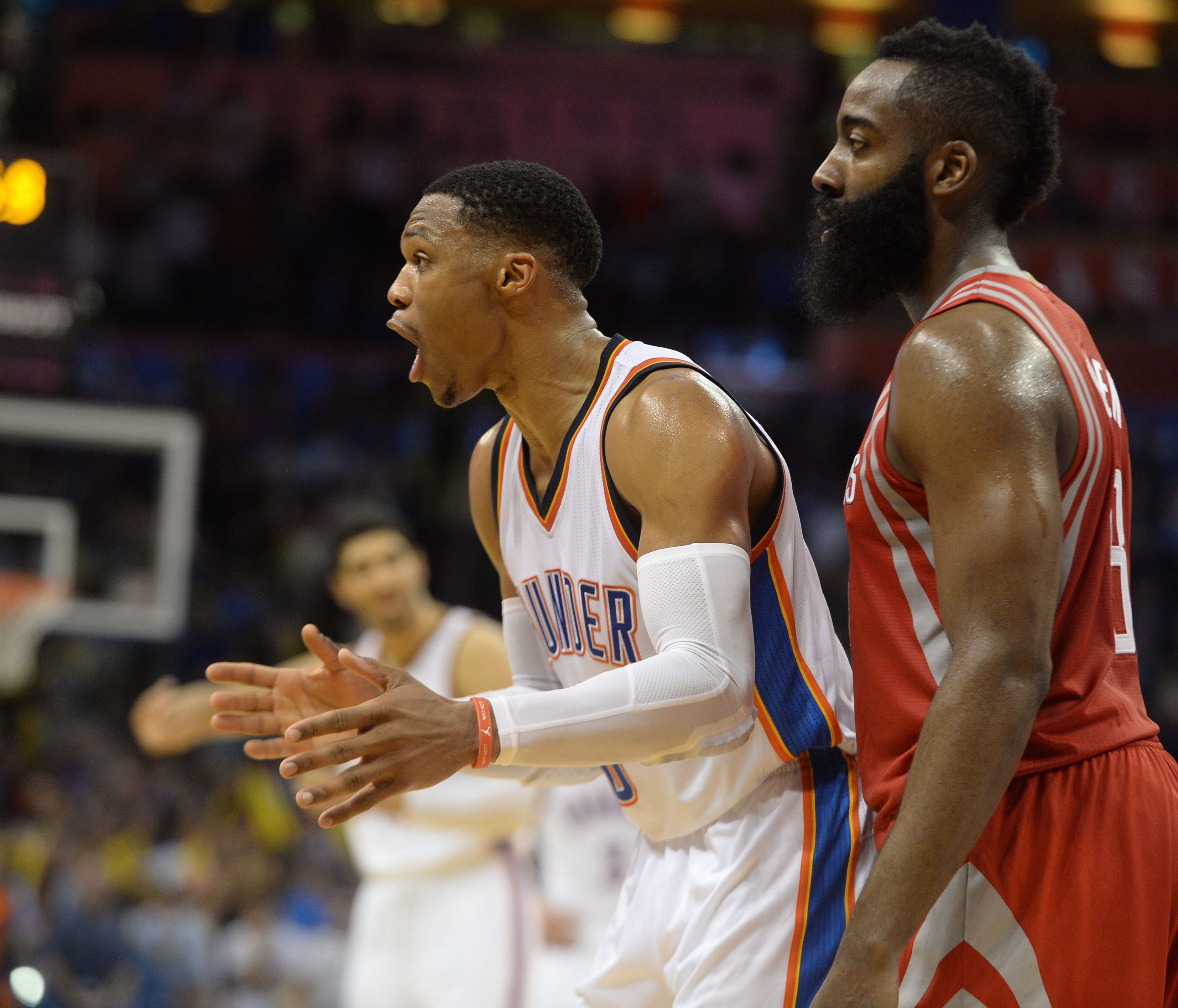 Oklahoma City Thunder guard Russell Westbrook (0) and Houston Rockets guard James Harden (13) react after a play against the Houston Rockets during the fourth quarter at Chesapeake Energy Arena. Mandatory Credit: Mark D. Smith-USA TODAY Sports