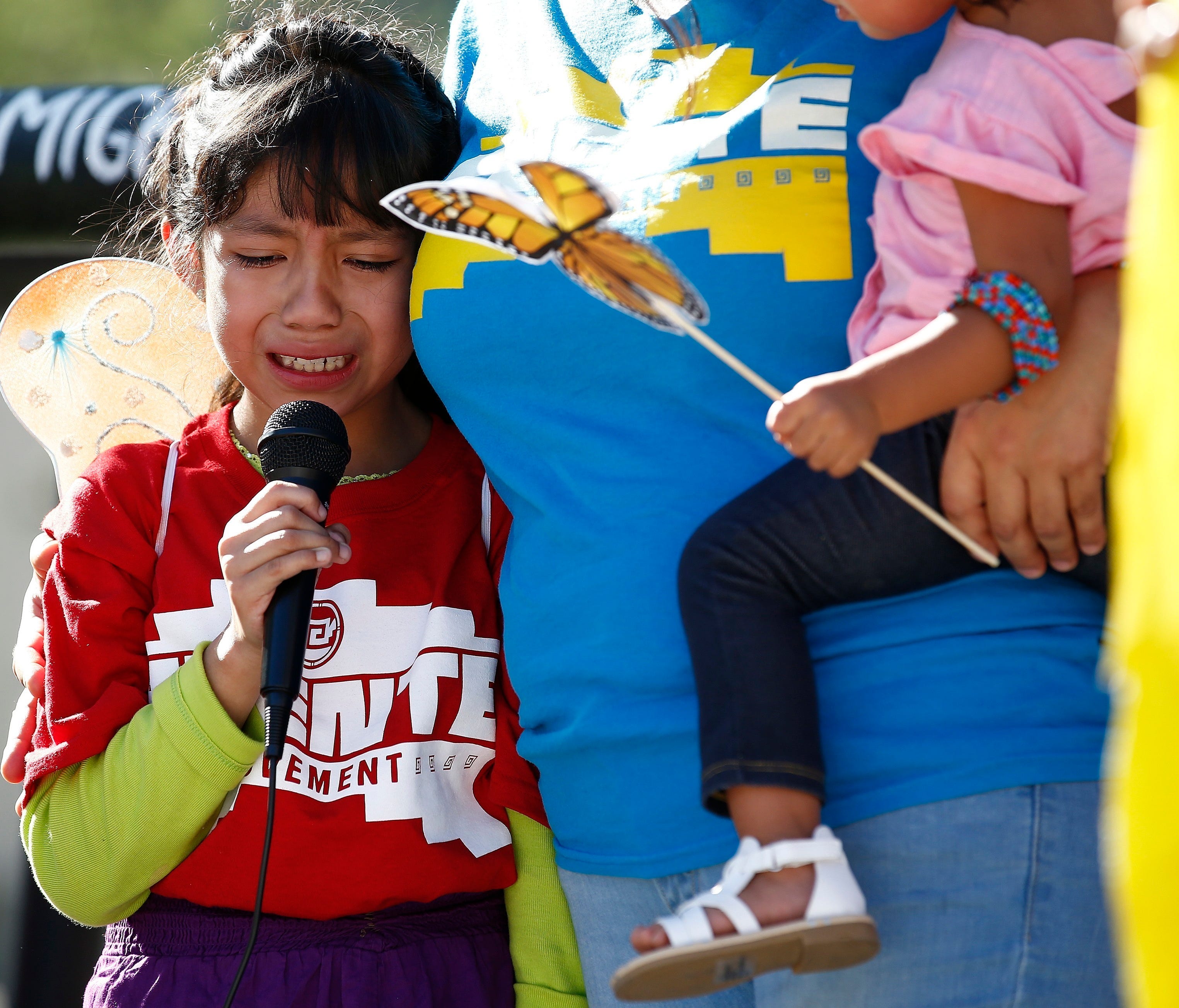 Akemi Vargas, 8, cries as she talks about being separated from her father during an immigration family separation protest in front of the Sandra Day O'Connor U.S. District Court building in Phoenix.