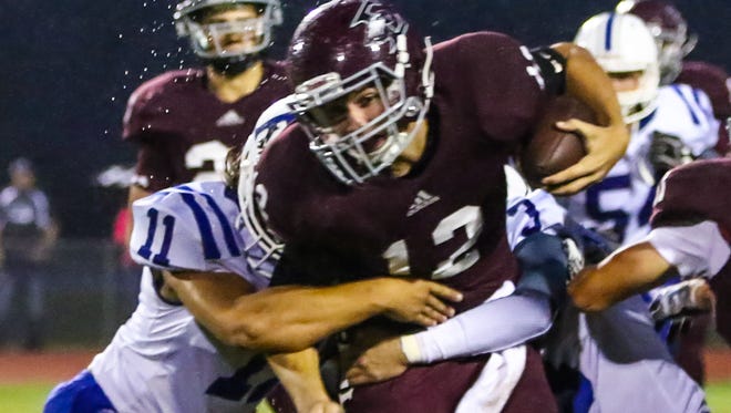 Eagleville and QB Ethan Cobb (12) dropped a 26-21 decision at Columbia Academy Friday.