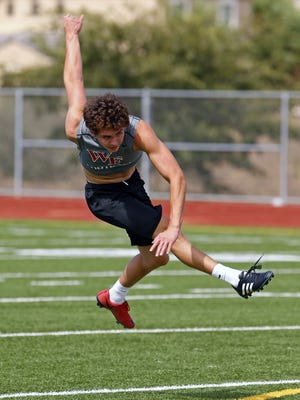 Williams Field High School kicker Brandon Ruiz works out Tuesday, July 28, 2015 in Gilbert, Ariz.