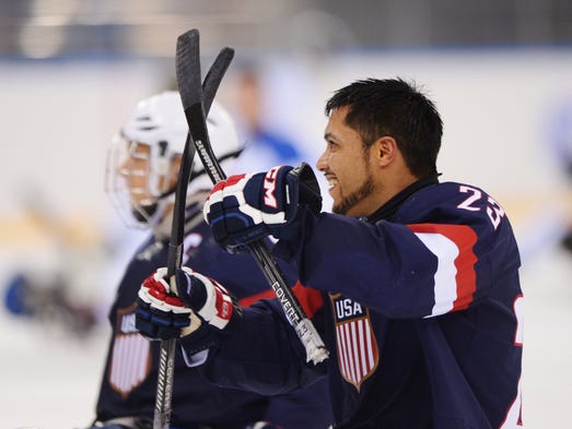 Rico Roman, right, was one of the U.S. sled hockey