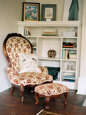 This undated photo provided by the F. Scott and Zelda Fitzgerald Museum in Montgomery shows a pillow on a chair embroidered with a quote from Zelda Fitzgerald: "She refused to be bored chiefly because she wasn't boring." The chair is in an apartment upstairs from the museum. The apartment and museum are located in a 1910 house where the Fitzgeralds lived in the 1930s.