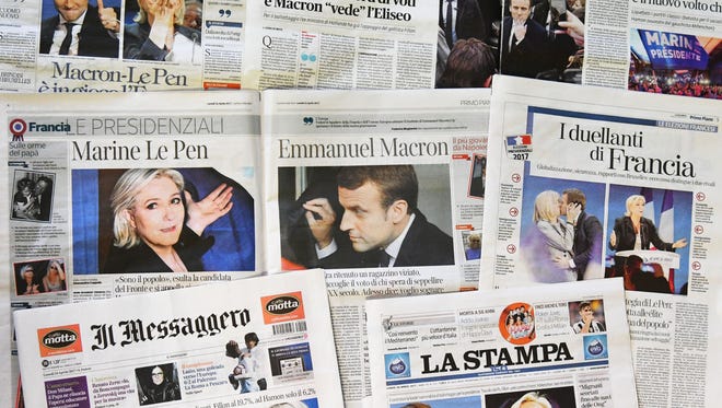 A picture shows front pages of Italian newspapers reporting on results of the first round of France's presidential electionon April 24, 2017 in Rome.
Pro-European Emmanuel Macron is set to face far-right candidate Marine Le Pen in France's presidential run-off, making him clear favourite to emerge as the country's youngest leader in modern history.