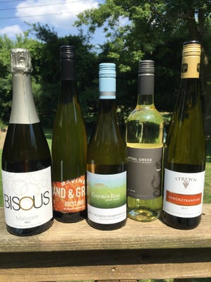 These Canadian white wines are great summer sippers. from left are the Malivoire “Bisous” Brut NV, Ravine “Sand & Gravel” Riesling 2015, Coyote’s Run Unoaked Chardonnay 2015, Cattail Creek White 2013 and Strewn Gewürztraminer 2014.