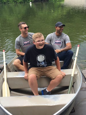 Tewksbury teen Tyler Cashman in a Central Park row boat with New York Yankees Aaron Hicks and Chasen Shreve. The 14-year-old also got to throw out the first pitch at the May 26 game against the Oakland A’s and received $10,000 from the Yankees to add to the $35,000 he has raised since 2015 on behalf of the U.S. Pain Foundation.