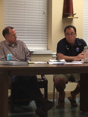 Verona United Soccer Club President Matt Bosco (left) and Team Administrator Justin Marriott listen to parent concerns.